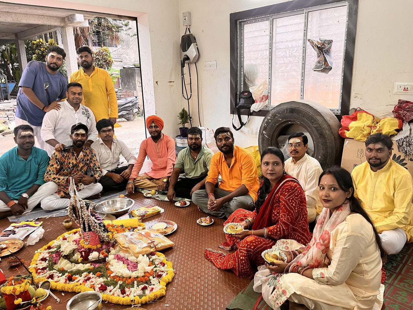 The team seated together at the office puja